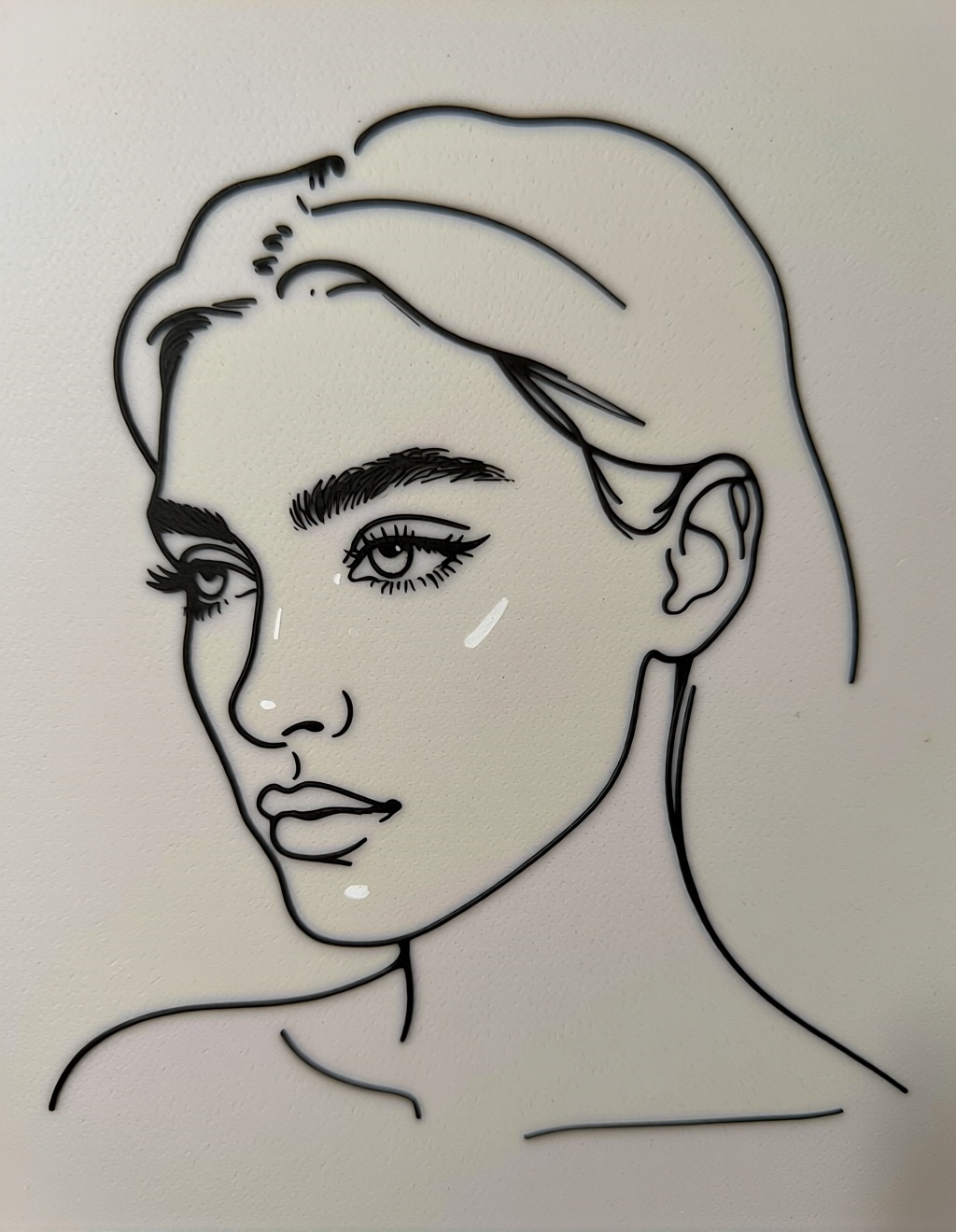 A minimalist single-line (one-line) drawing of a person's face in profile. The entire portrait is created with one continuous, flowing black line on a plain white background. Elegant, simple, clean. Captures the essence of the form with no shading. Style of a modern tattoo design or Matisse's line drawings.